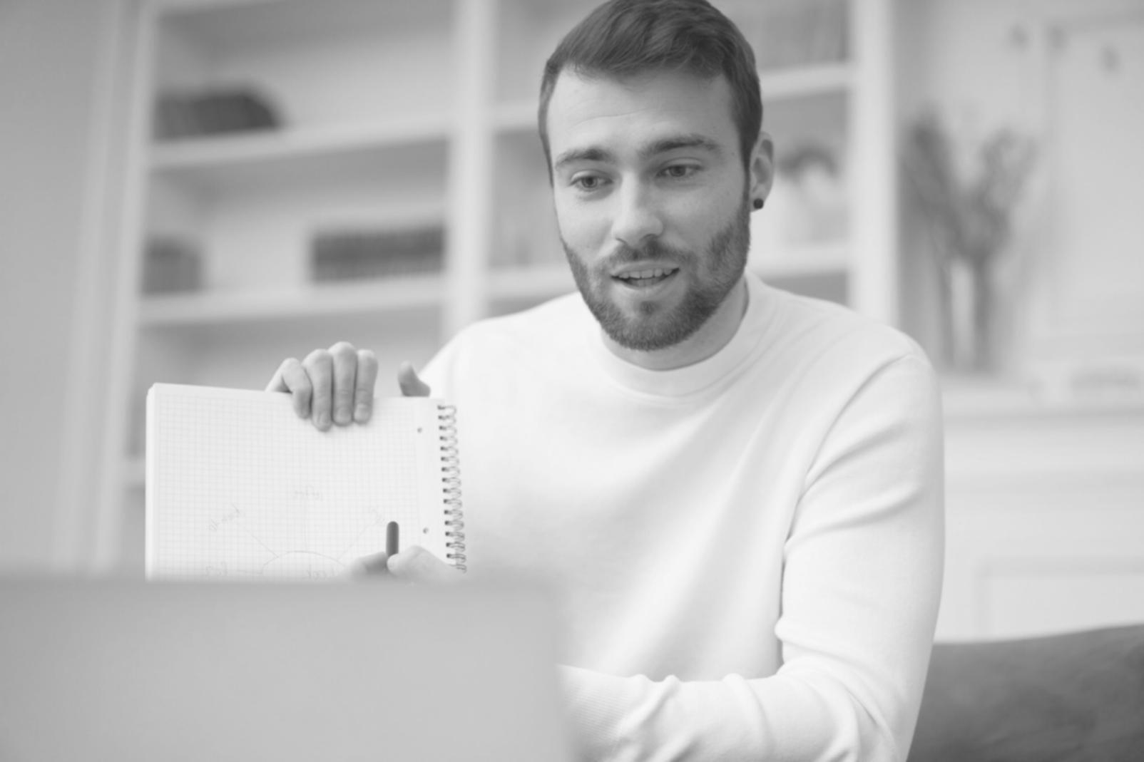 Strategic business planning session showing scenario analysis and financial modeling worksheets